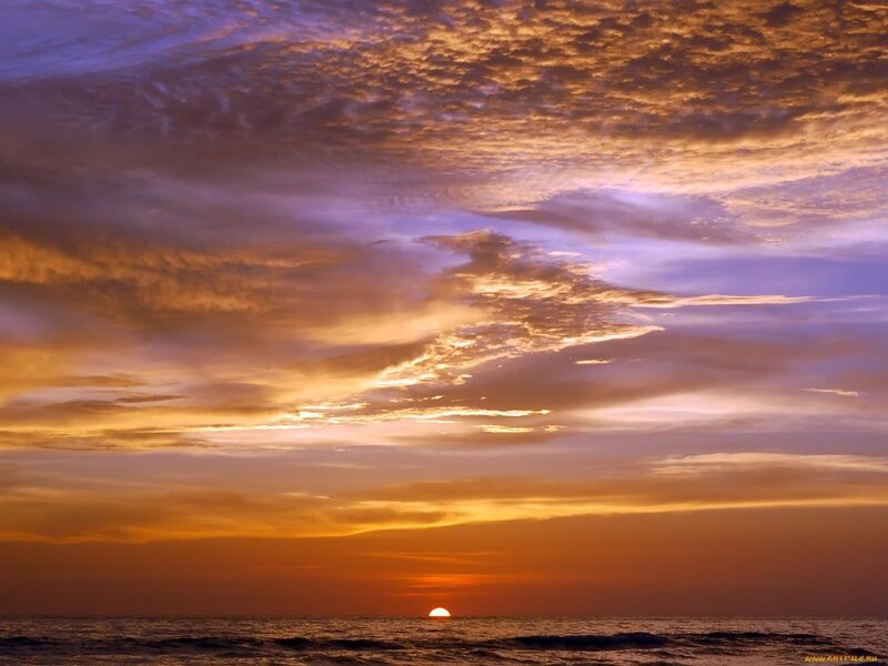 Sun Setting over Ocean — Dramatic, Purple