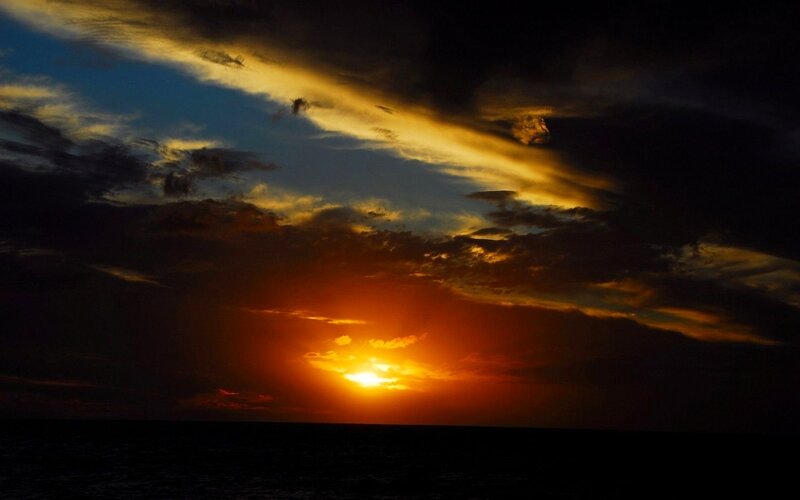 Sun Setting over Ocean — Dramatic, Sky