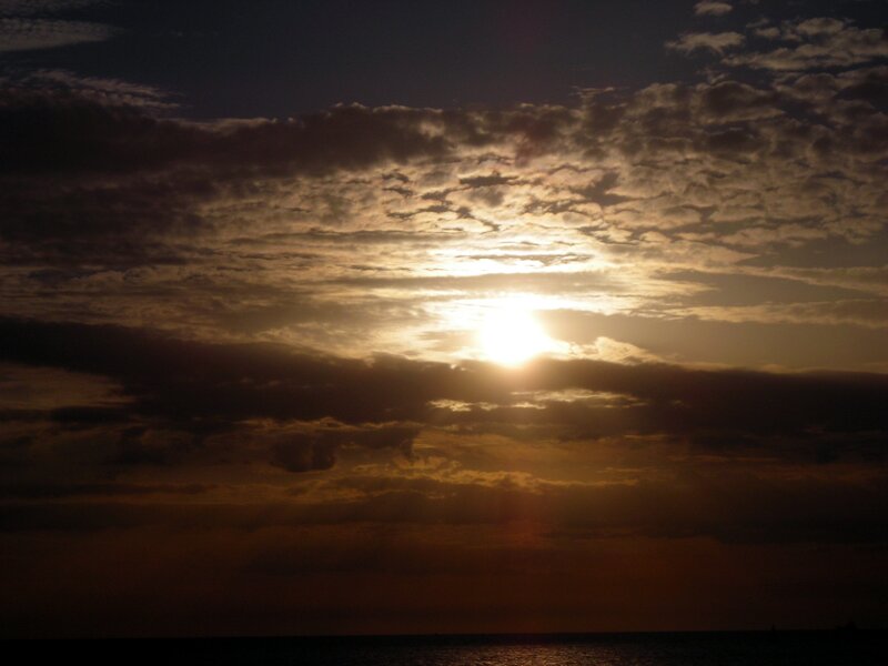 Sun Setting over Ocean — Gold, Dramatic, Sunset, Photograph, Clouds, Brown