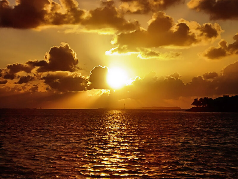 Sun Setting over Ocean — Gold, Dramatic, Sunset