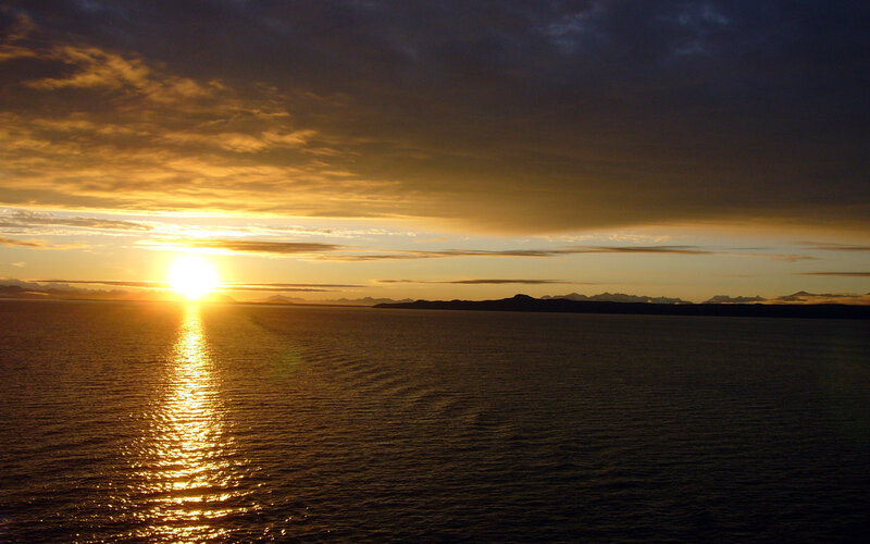 Sun Setting over Ocean — Gold, Serene, Sunset, Photograph, Mountains