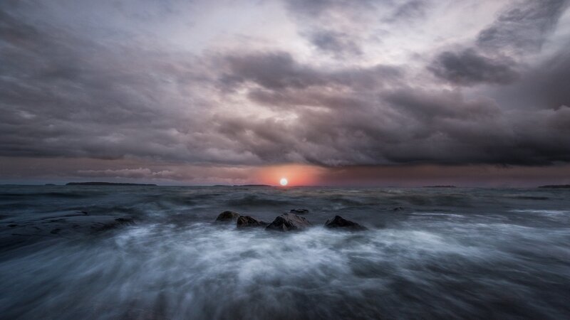 Sun Setting over Ocean — Gray, Dramatic, Sunset