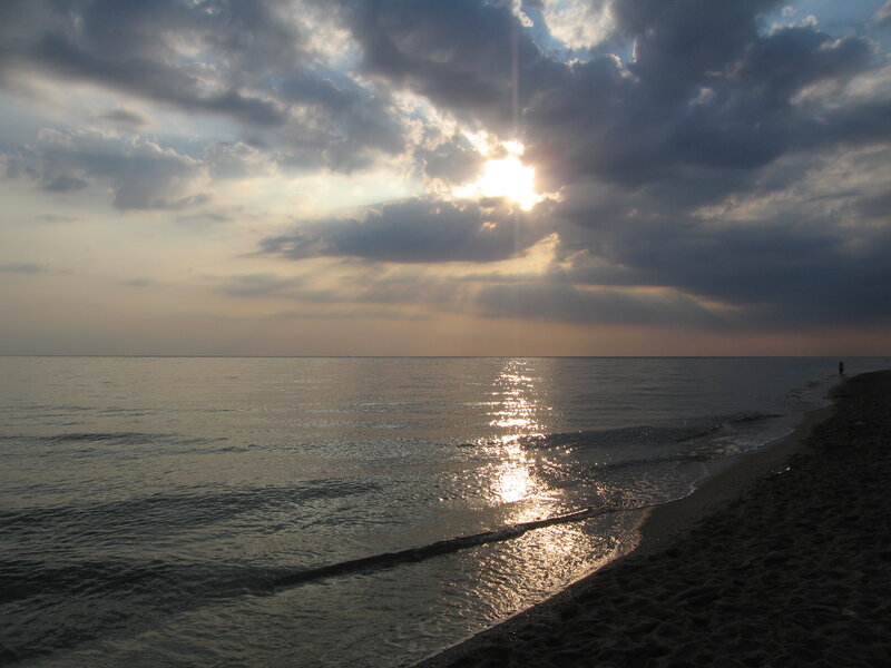 Sun Setting over Ocean — Gray
