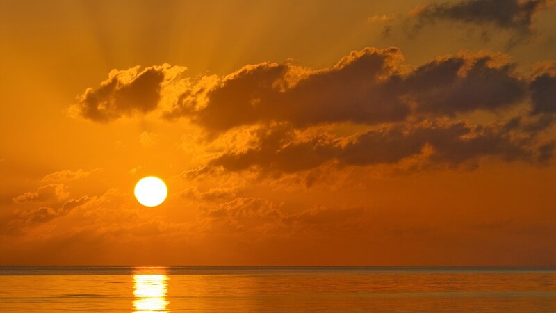 Sun Setting over Ocean — Orange, Brown