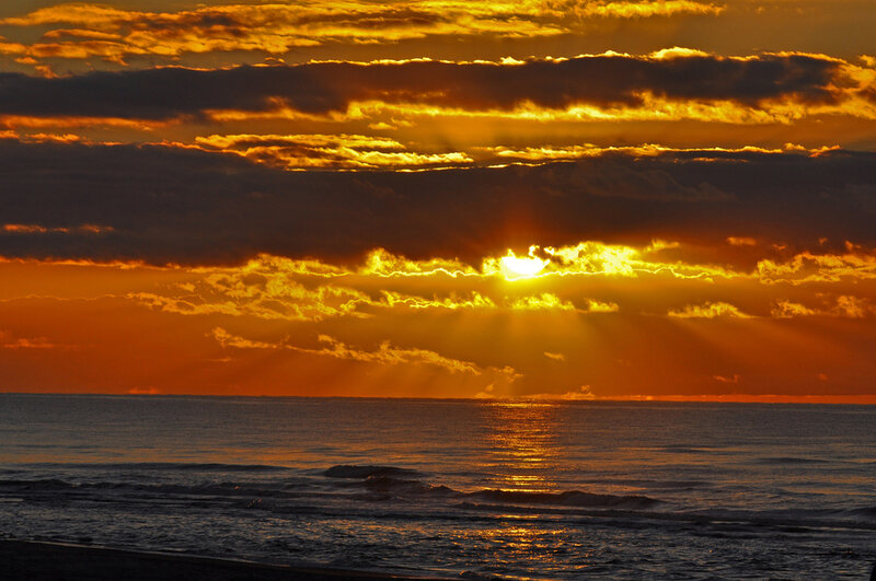 Sun Setting over Ocean — Orange, Dramatic, Sunset, Photograph, Clouds, Beach