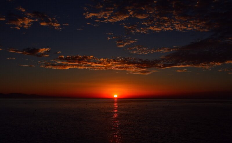 Sun Setting over Ocean — Orange, Dramatic, Sunset, Photograph, Clouds, Horizon