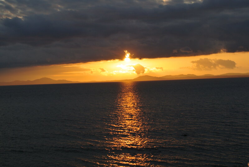 Sun Setting over Ocean — Orange, Dramatic, Sunset, Photograph, Clouds, Mountains