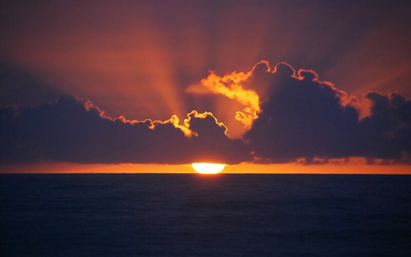 Sun Setting over Ocean — Orange, Dramatic, Sunset, Photograph, Clouds, Purple, Blue