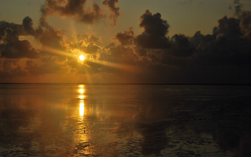 Sun Setting over Ocean — Orange, Dramatic, Sunset, Photograph, Clouds, Reflection, Horizon
