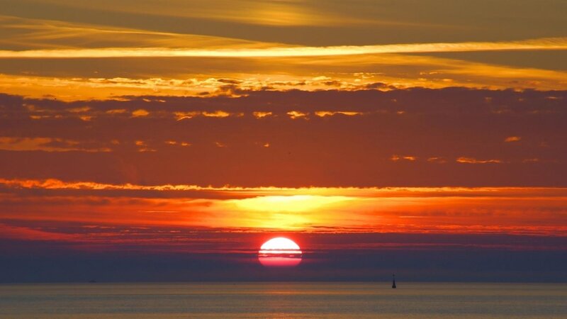 Sun Setting over Ocean — Orange, Dramatic, Sunset, Photograph, Clouds, Sailboat