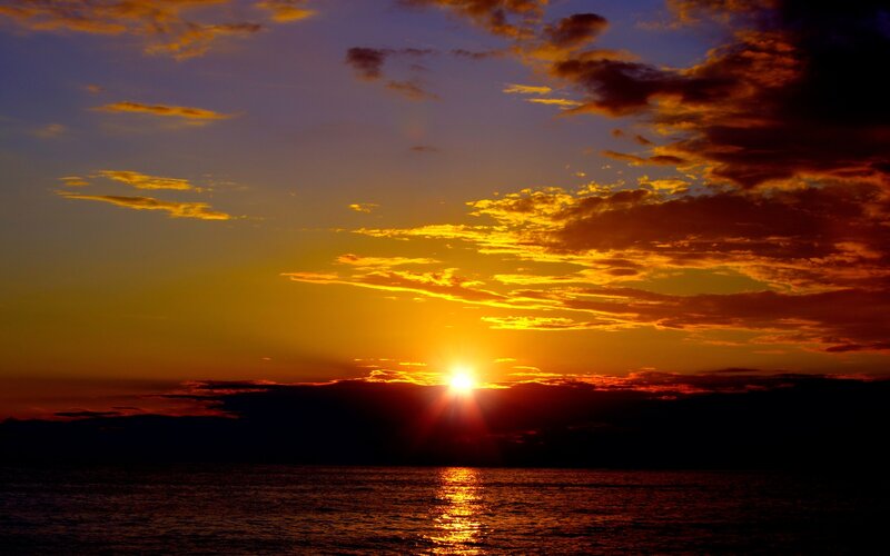 Sun Setting over Ocean — Orange, Dramatic, Sunset, Photograph, Clouds, Sea, Mountains