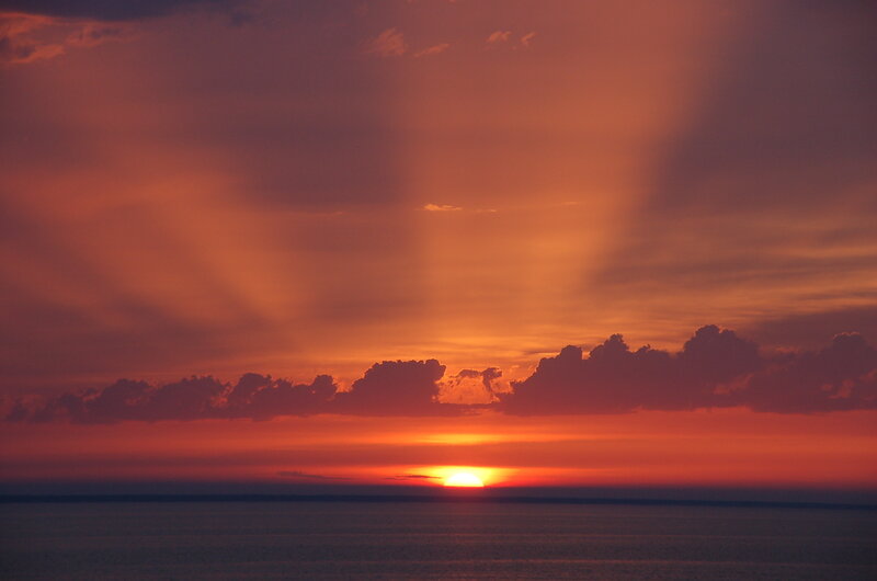 Sun Setting over Ocean — Orange, Dramatic, Sunset, Photograph, Clouds, Sky, Sea
