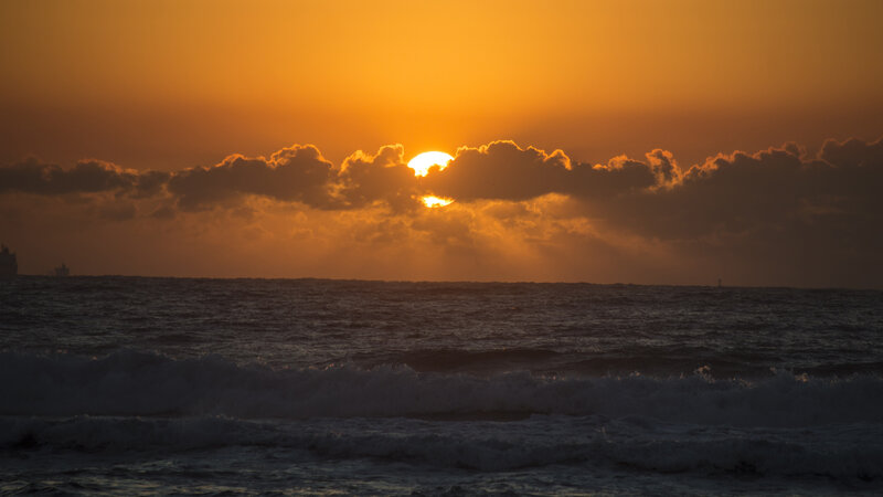 Sun Setting over Ocean — Orange, Dramatic, Sunset, Photograph, Clouds, Waves, Ship