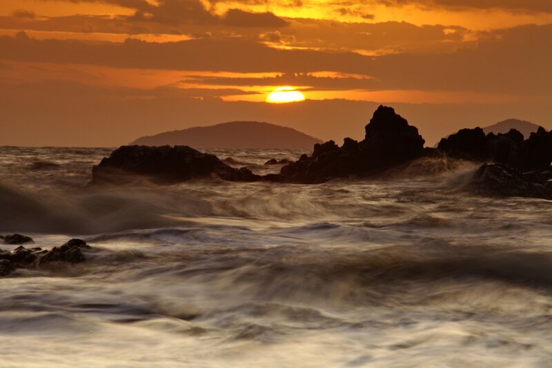 Sun Setting over Ocean — Orange, Dramatic, Sunset, Photograph, Rocks