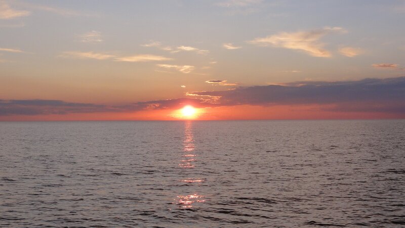 Sun Setting over Ocean — Orange, Gray