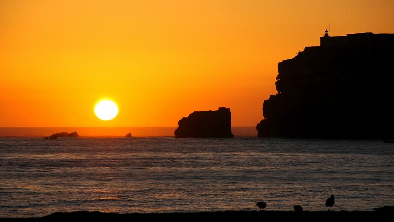 Sun Setting over Ocean — Orange, Serene, Sunset, Photograph, Cliffs, Rocks