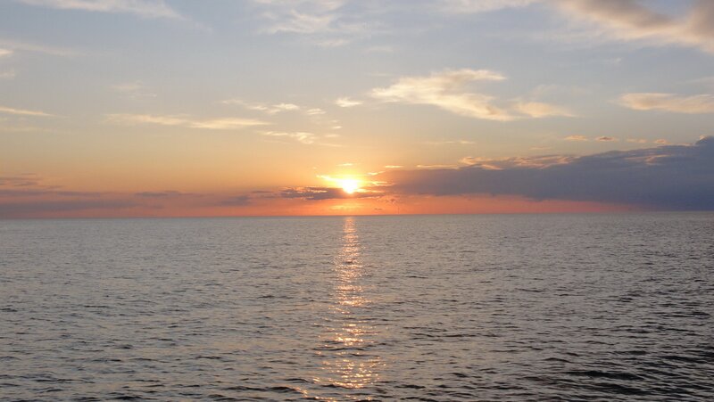 Sun Setting over Ocean — Orange, Serene, Sunset, Photograph, Clouds, Blue, Gray