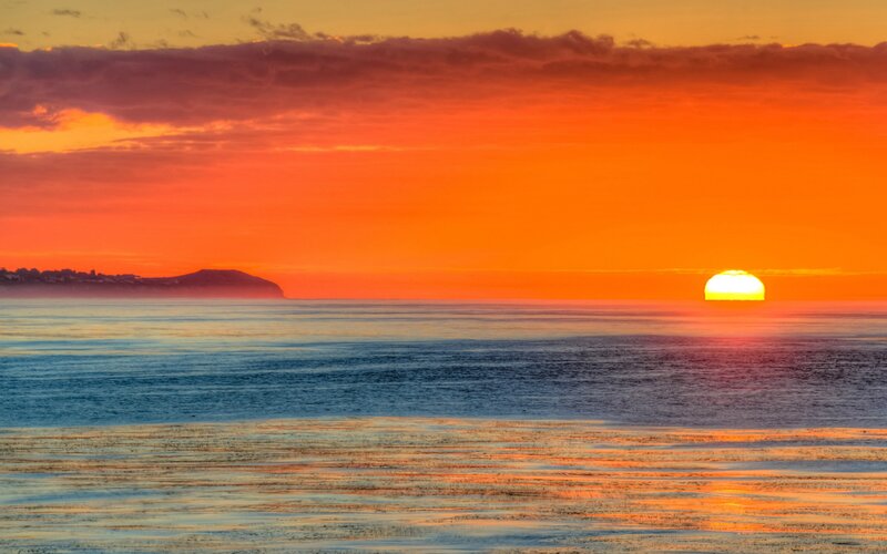 Sun Setting over Ocean — Orange, Serene, Sunset, Photograph, Clouds, Island