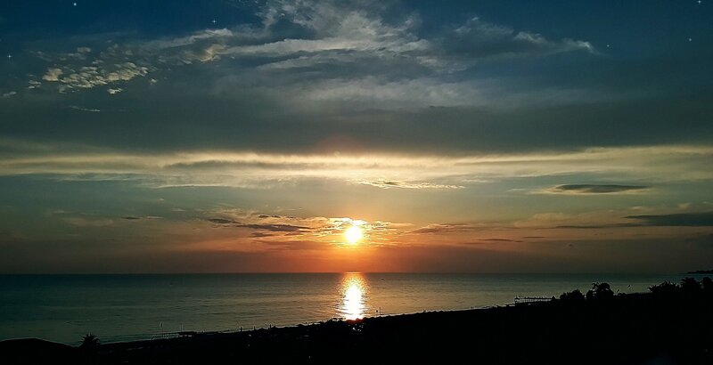 Sun Setting over Ocean — Orange, Serene, Sunset, Photograph, Clouds, Silhouette