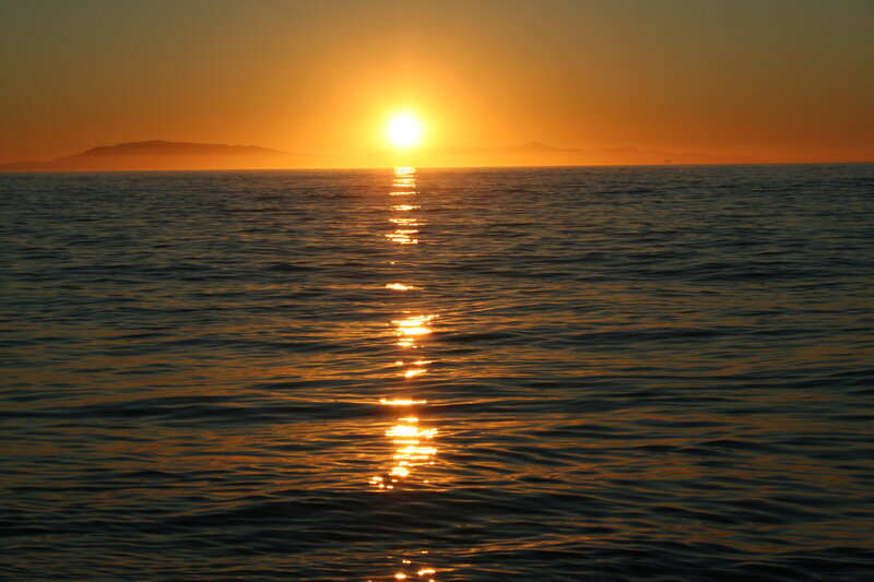 Sun Setting over Ocean — Orange, Serene, Sunset, Photograph, Mountains, Reflection
