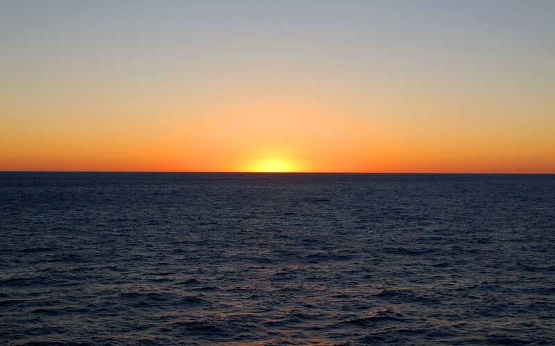 Sun Setting over Ocean — Orange, Serene, Sunset, Photograph, Sky, Blue, Yellow