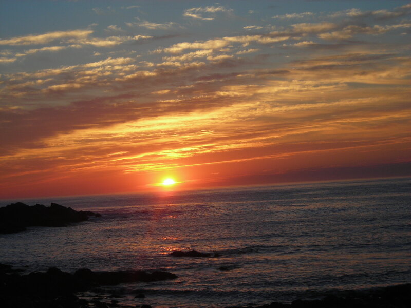 Sun Setting over Ocean — Orange, Serene, Sunset, Photograph, Sky, Clouds, Rocks