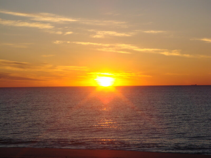 Sun Setting over Ocean — Orange, Serene, Sunset, Photograph, Sky, Clouds, Sand