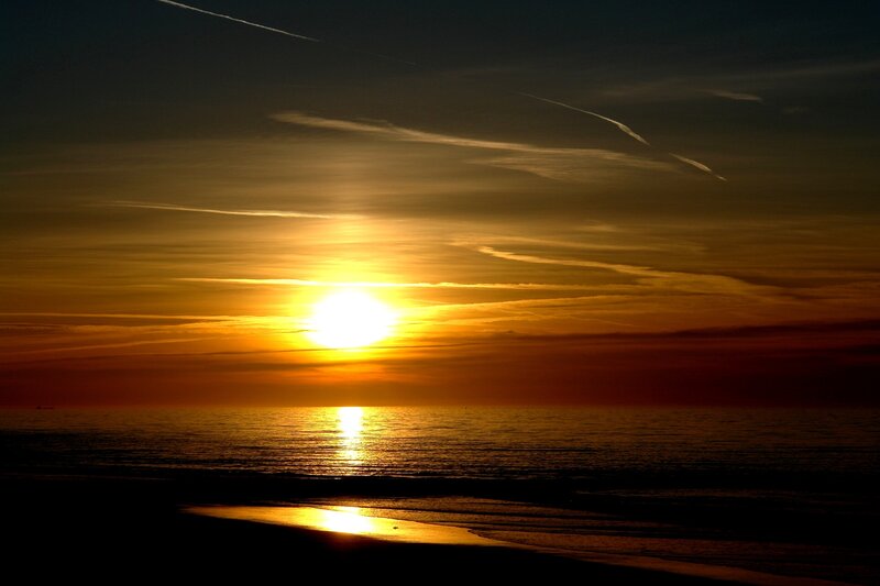 Sun Setting over Ocean — Orange, Serene, Sunset, Photograph, Sky, Clouds, Yellow, Black