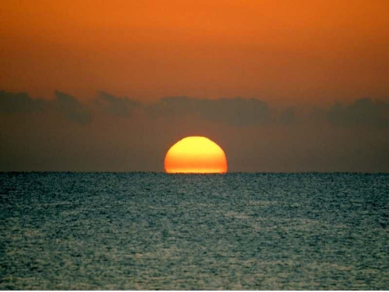 Sun Setting over Ocean — Orange, Serene, Sunset, Photograph, Sky, Clouds, Yellow, Blue