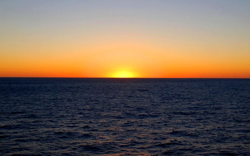 Sun Setting over Ocean — Orange, Serene, Sunset, Photograph, Sky, Horizon, Blue