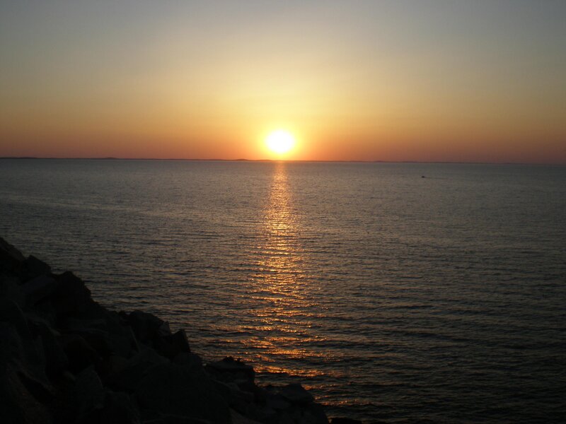 Sun Setting over Ocean — Orange, Serene, Sunset, Photograph, Sky, Rocks, Blue