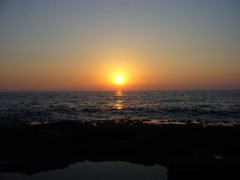 Sun Setting over Ocean — Orange, Serene, Sunset, Photograph, Sky, Rocks