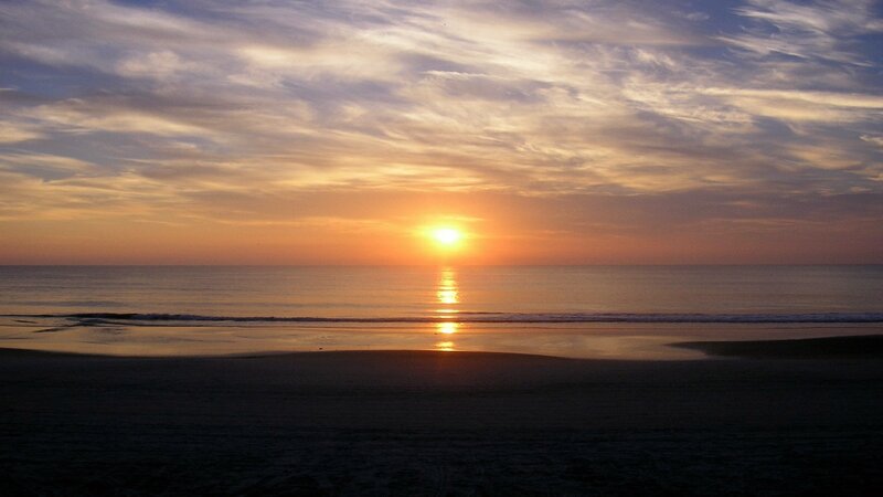 Sun Setting over Ocean — Orange, Serene, Sunset, Photograph, Sky, Sand, Waves