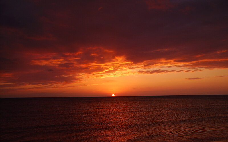 Sun Setting over Ocean — Photograph, Black