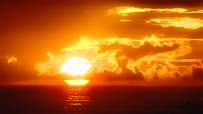 Sun Setting over Ocean — Photograph, Yellow