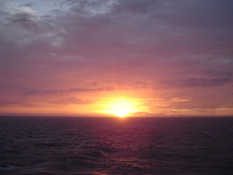 Sun Setting over Ocean — Purple, Serene, Sunset, Photograph, Sky, Clouds