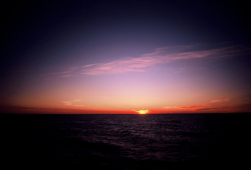 Sun Setting over Ocean — Purple, Serene