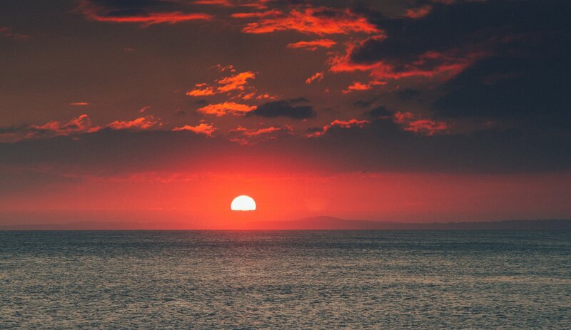 Sun Setting over Ocean — Red, Dramatic, Sunset, Photograph, Clouds, Horizon