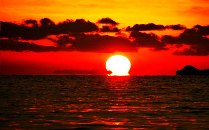 Sun Setting over Ocean — Red, Dramatic, Sunset, Photograph, Clouds, Island