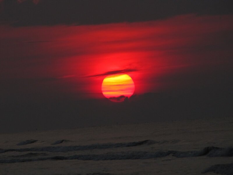 Sun Setting over Ocean — Red, Dramatic, Sunset, Photograph, Clouds, Sky