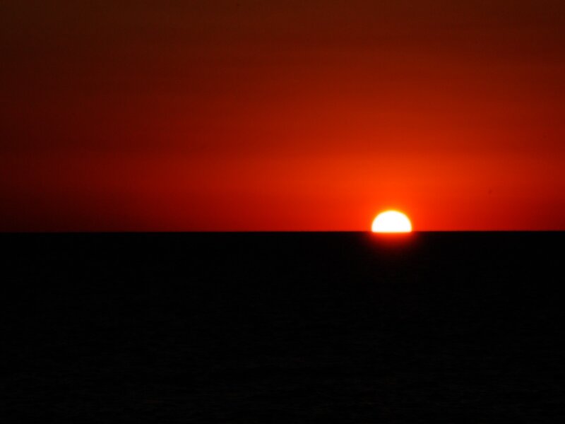 Sun Setting over Ocean — Red, Dramatic, Sunset, Photograph, Sky, Black
