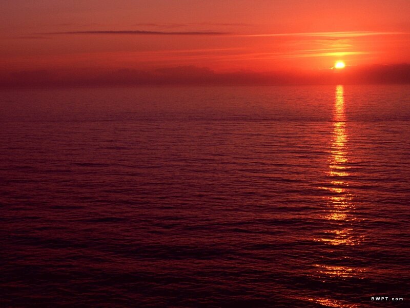 Sun Setting over Ocean — Red, Orange