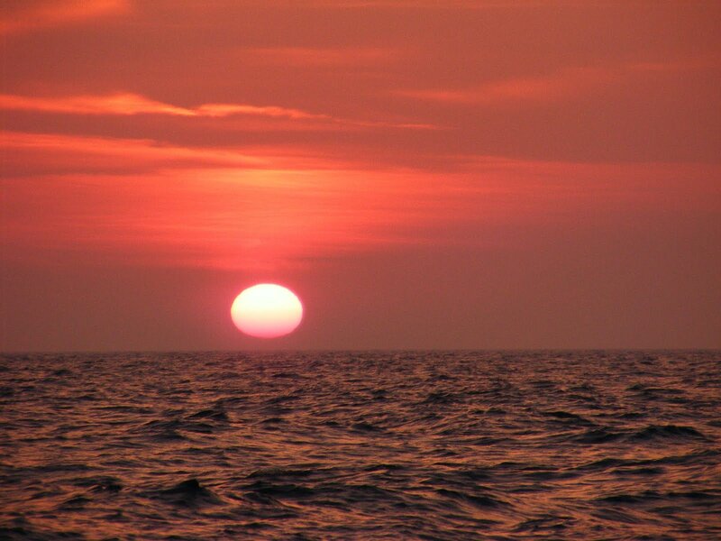 Sun Setting over Ocean — Red, Serene, Sunset, Photograph, Sky, Clouds, Orange
