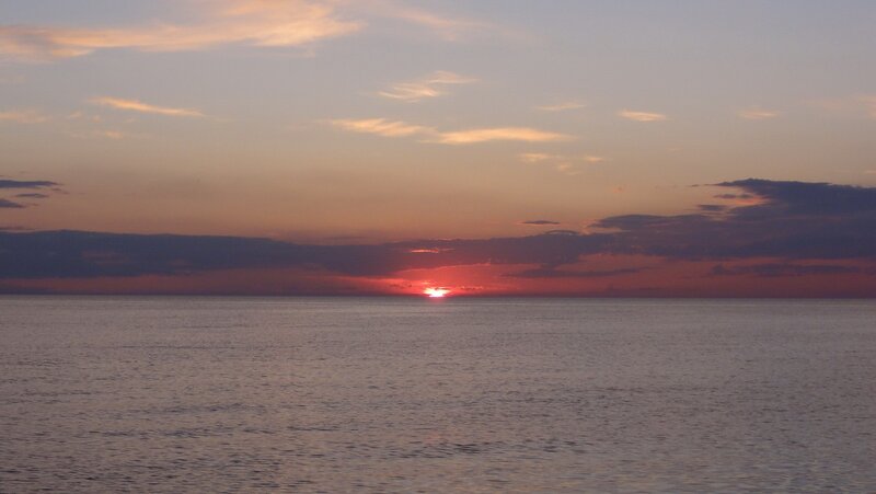 Sun Setting over Ocean — Red, Serene, Sunset, Photograph, Sky, Clouds
