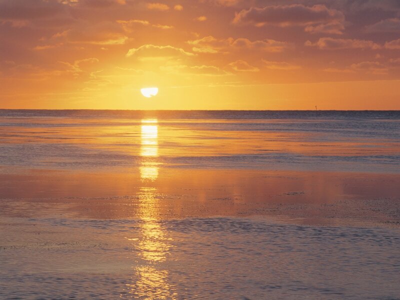 Sun Setting over Ocean — Reflection