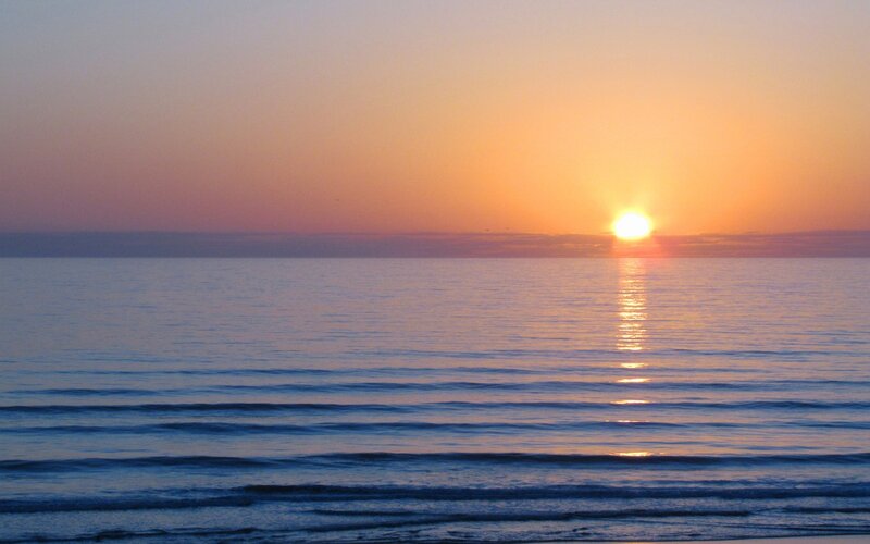 Sun Setting over Ocean — Sky