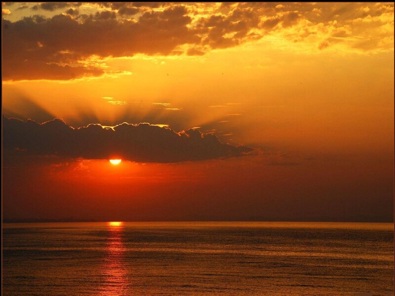 Sun Setting over Ocean — Sunset, Red