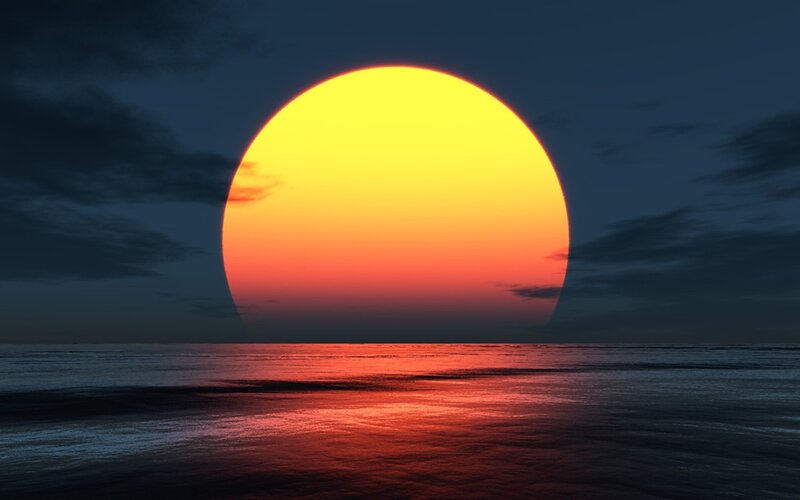 Sun Setting over Ocean — Yellow, Clouds