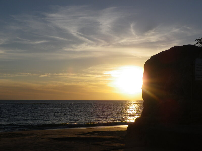 Sun Setting over Ocean — Yellow, Serene, Sunset, Photograph, Rock