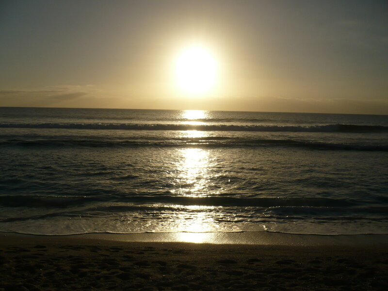 Sun Setting over Ocean — Yellow, Serene, Sunset, Photograph, Sand, Sky, Blue